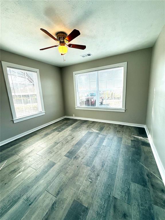 343 Chastain Mill Road Dawsonville, GA 30534 - Photo 10 of 12 a view of an empty room with a window