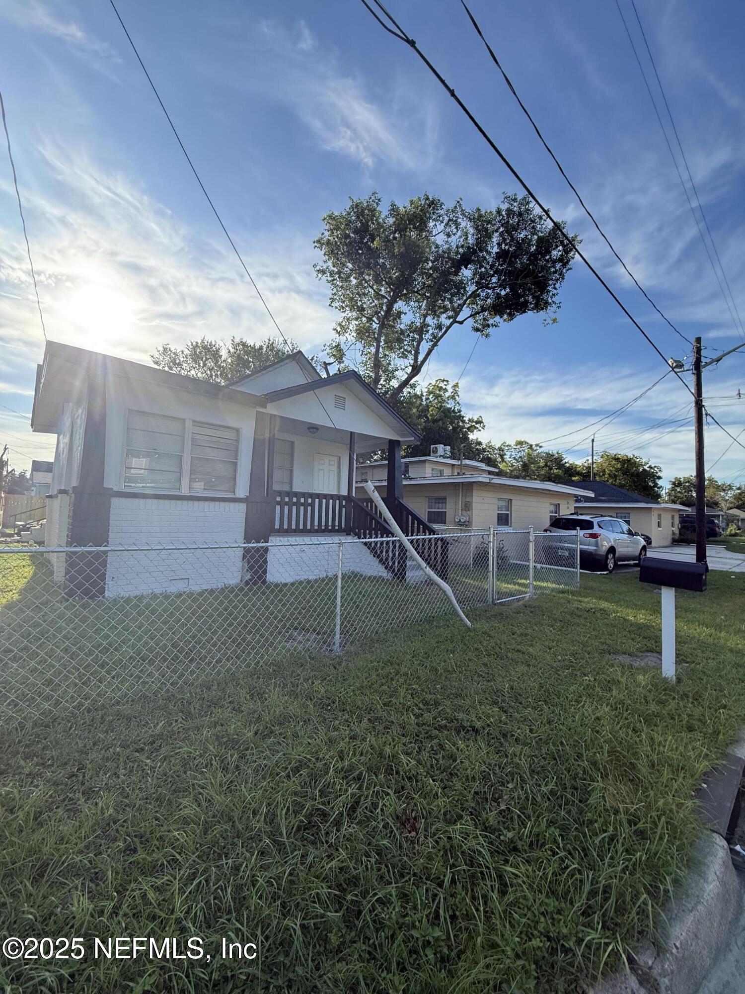830 Rushing Street Jacksonville, FL 32209 - Photo 1 of 6 a view of backyard with green space