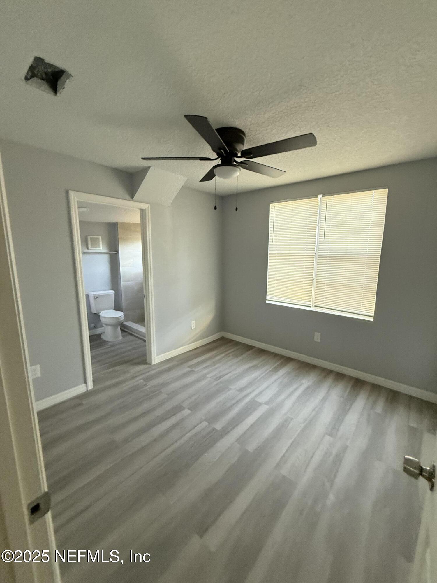 830 Rushing Street Jacksonville, FL 32209 - Photo 5 of 6 a view of an empty room and a window