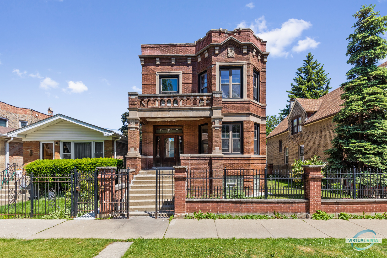 1521 North Springfield Avenue Chicago, IL 60651 - Photo 1 of 40 a front view of a house with a yard