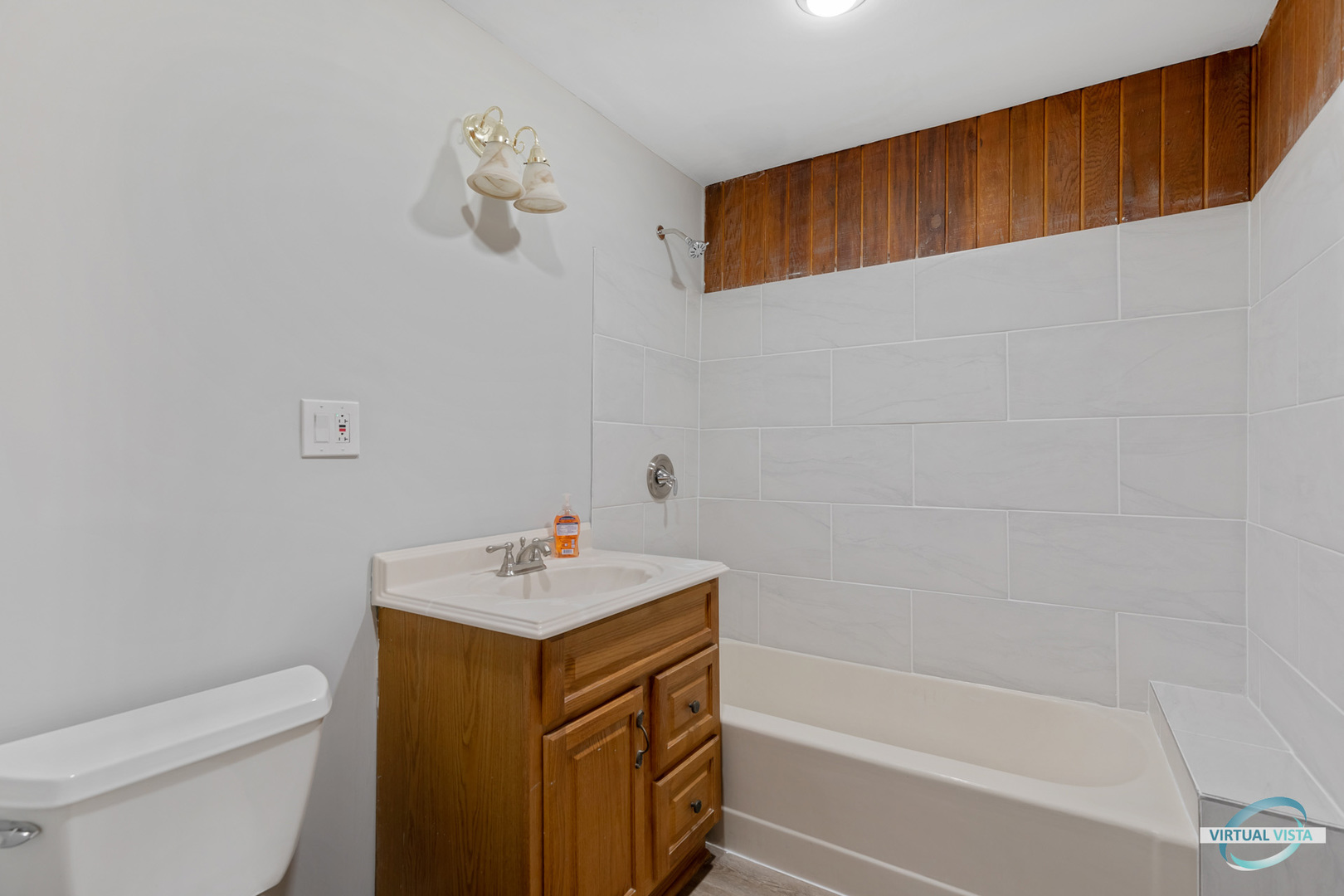1521 North Springfield Avenue Chicago, IL 60651 - Photo 11 of 40 a bathroom with a sink a toilet and shower