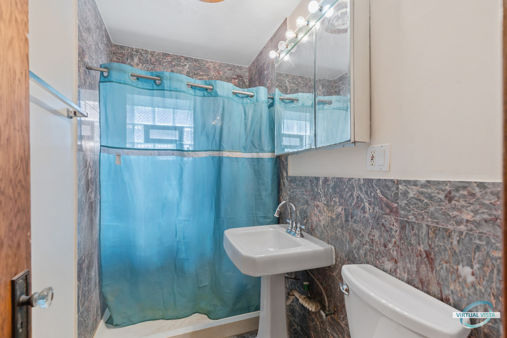 1521 North Springfield Avenue Chicago, IL 60651 - Photo 12 of 40 a bathroom with a sink a toilet and shower
