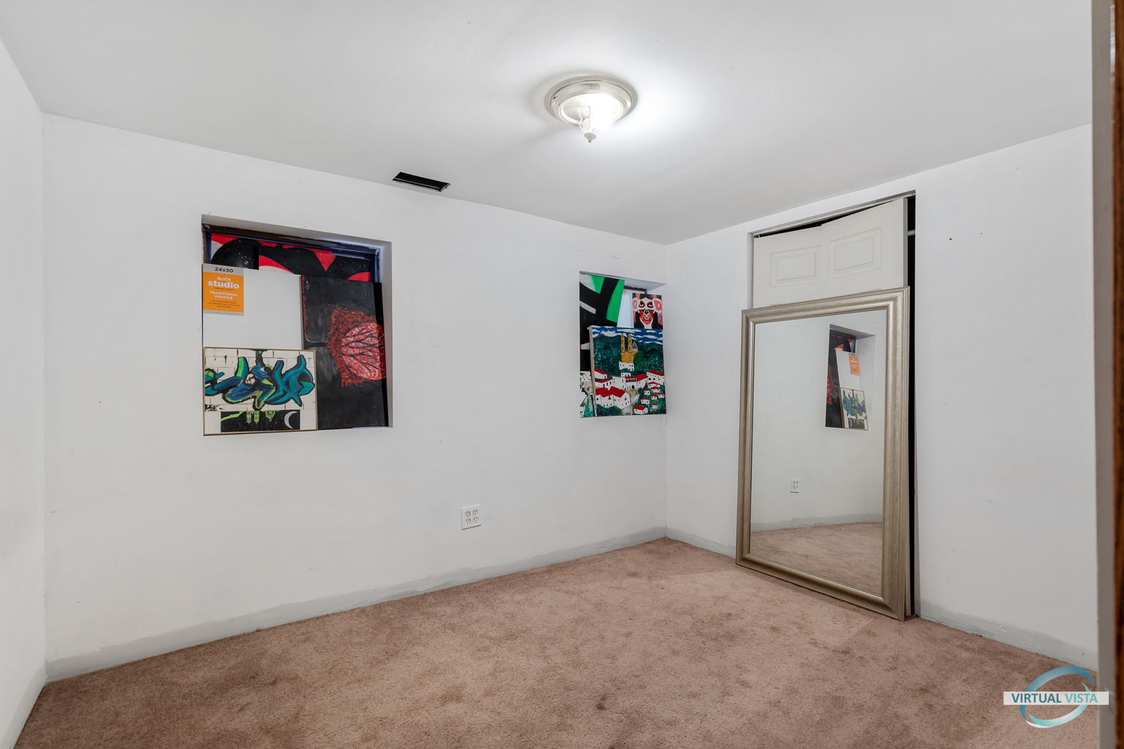 1521 North Springfield Avenue Chicago, IL 60651 - Photo 18 of 40 an empty room with painting on the wall
