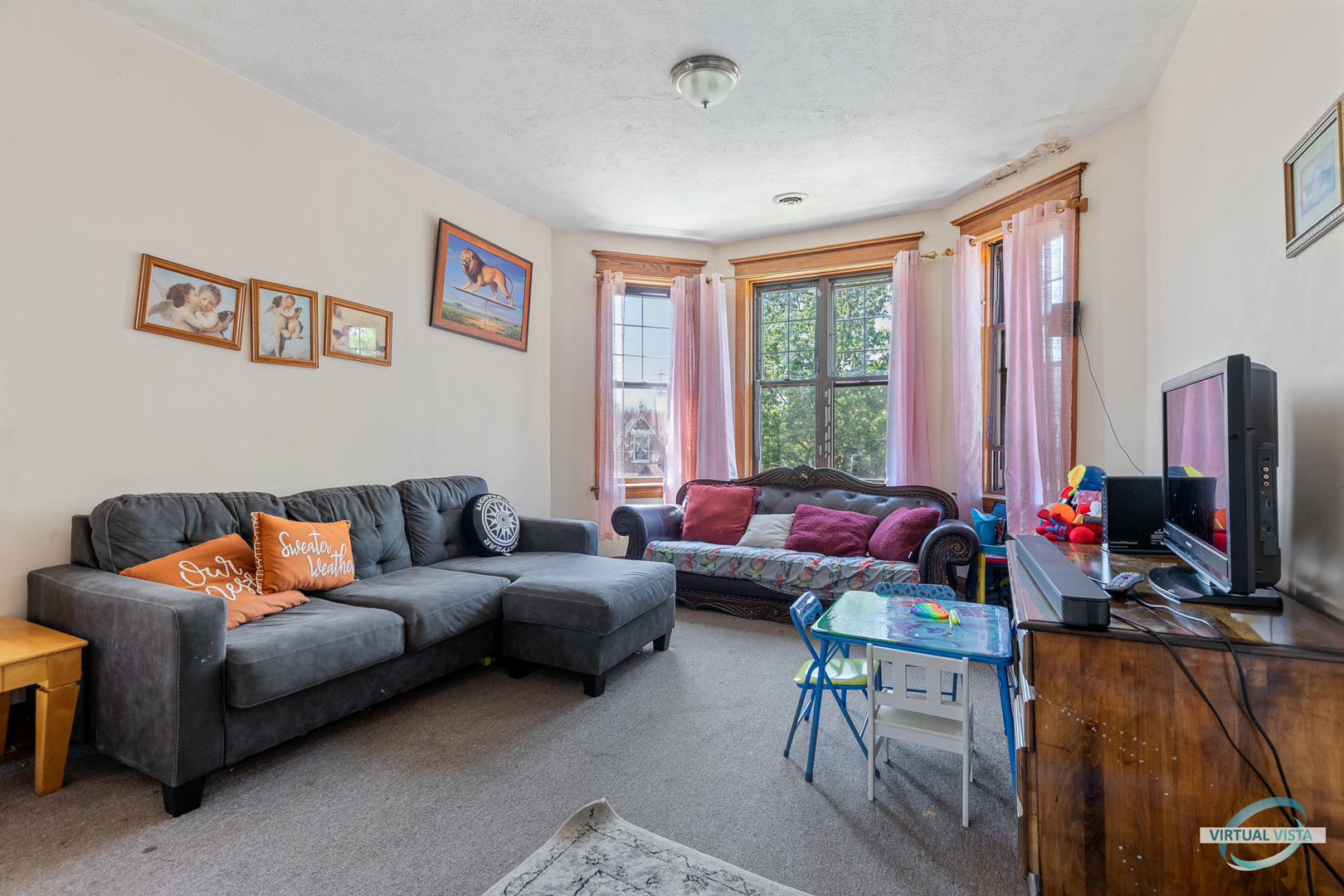 1521 North Springfield Avenue Chicago, IL 60651 - Photo 29 of 40 a living room with furniture and a flat screen tv