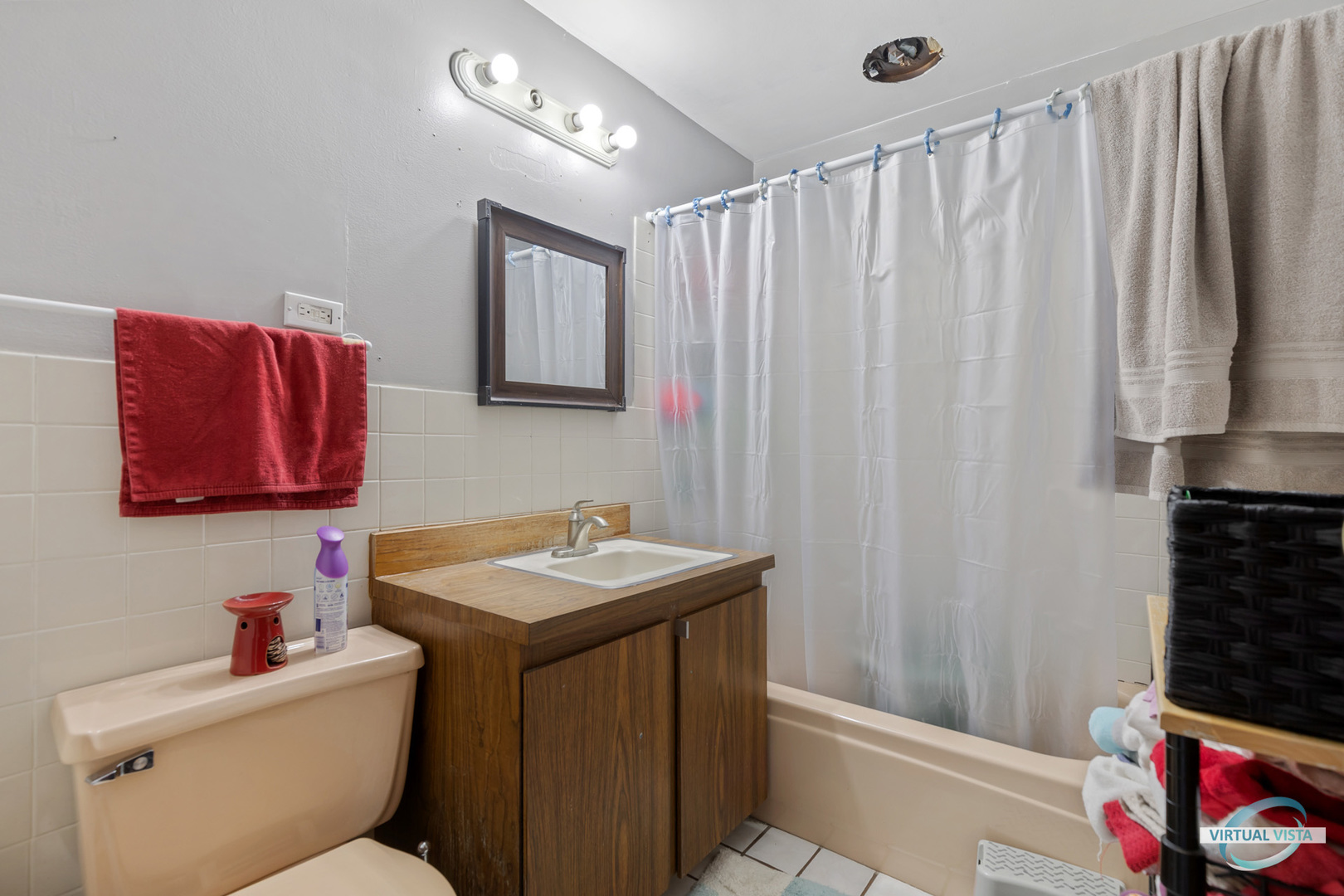 1521 North Springfield Avenue Chicago, IL 60651 - Photo 31 of 40 a bathroom with a sink a toilet and shower curtain