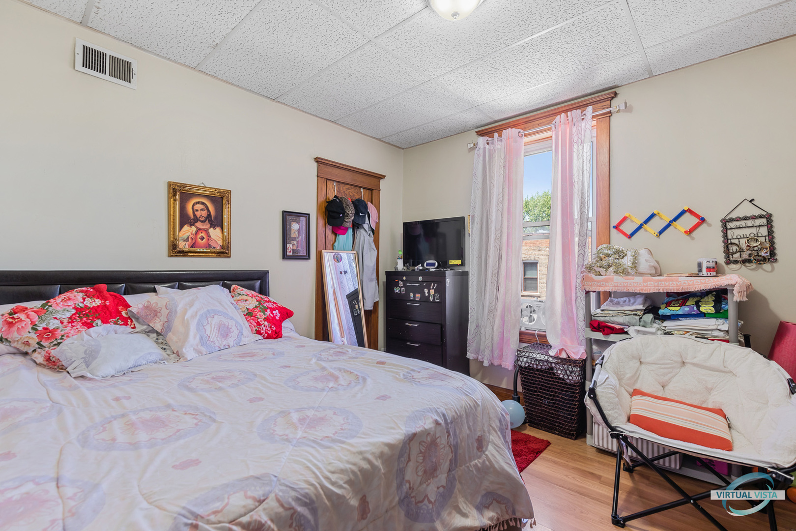 1521 North Springfield Avenue Chicago, IL 60651 - Photo 35 of 40 a bedroom with a bed and dresser