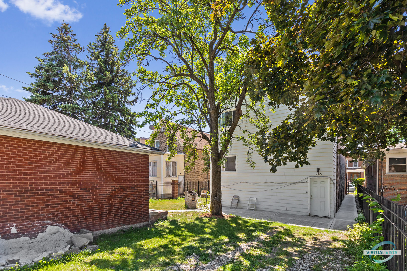 1521 North Springfield Avenue Chicago, IL 60651 - Photo 39 of 40 a backyard of a house with lots of green space
