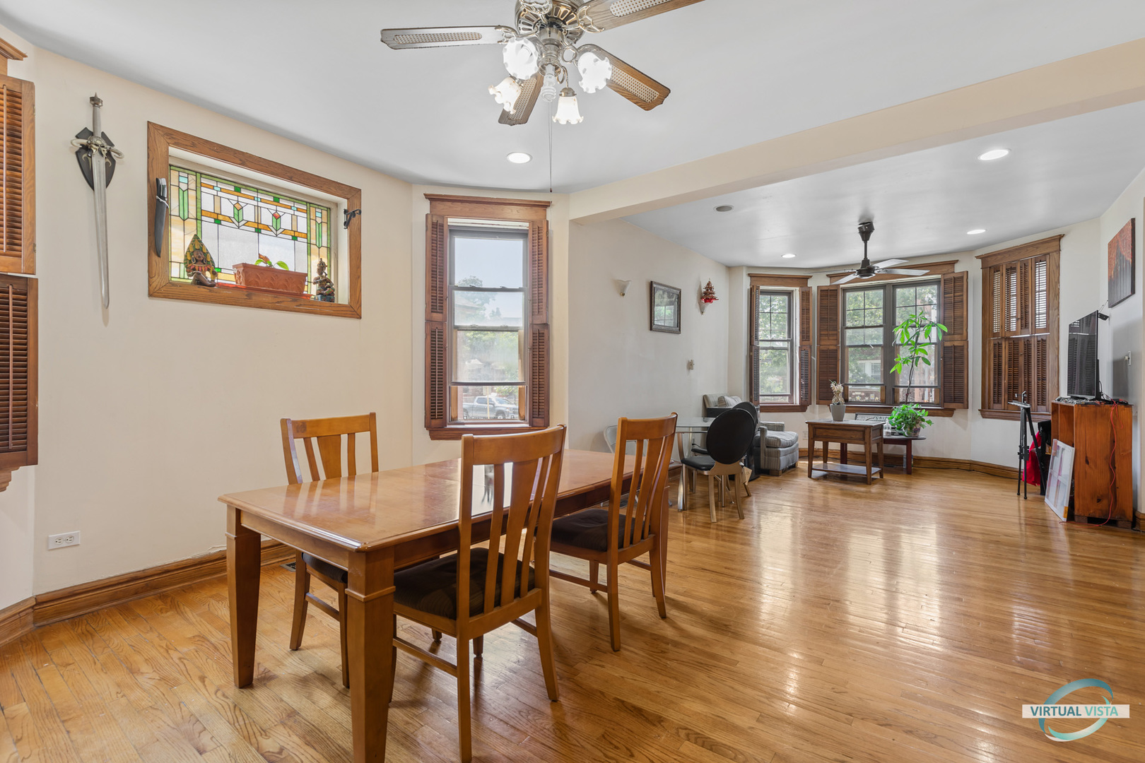 1521 North Springfield Avenue Chicago, IL 60651 - Photo 7 of 40 a view of a dining room with furniture window and wooden floor