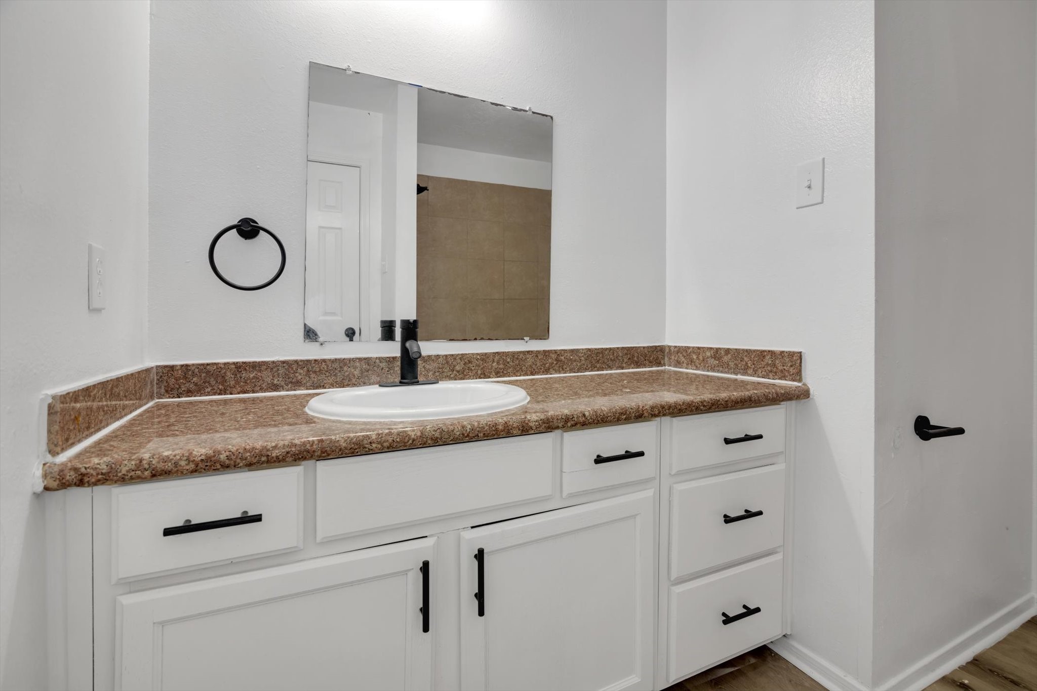 6933 Liverpool Street, Unit A Houston, TX 77021 - Photo 11 of 49 a bathroom with a granite countertop sink and white vanity
