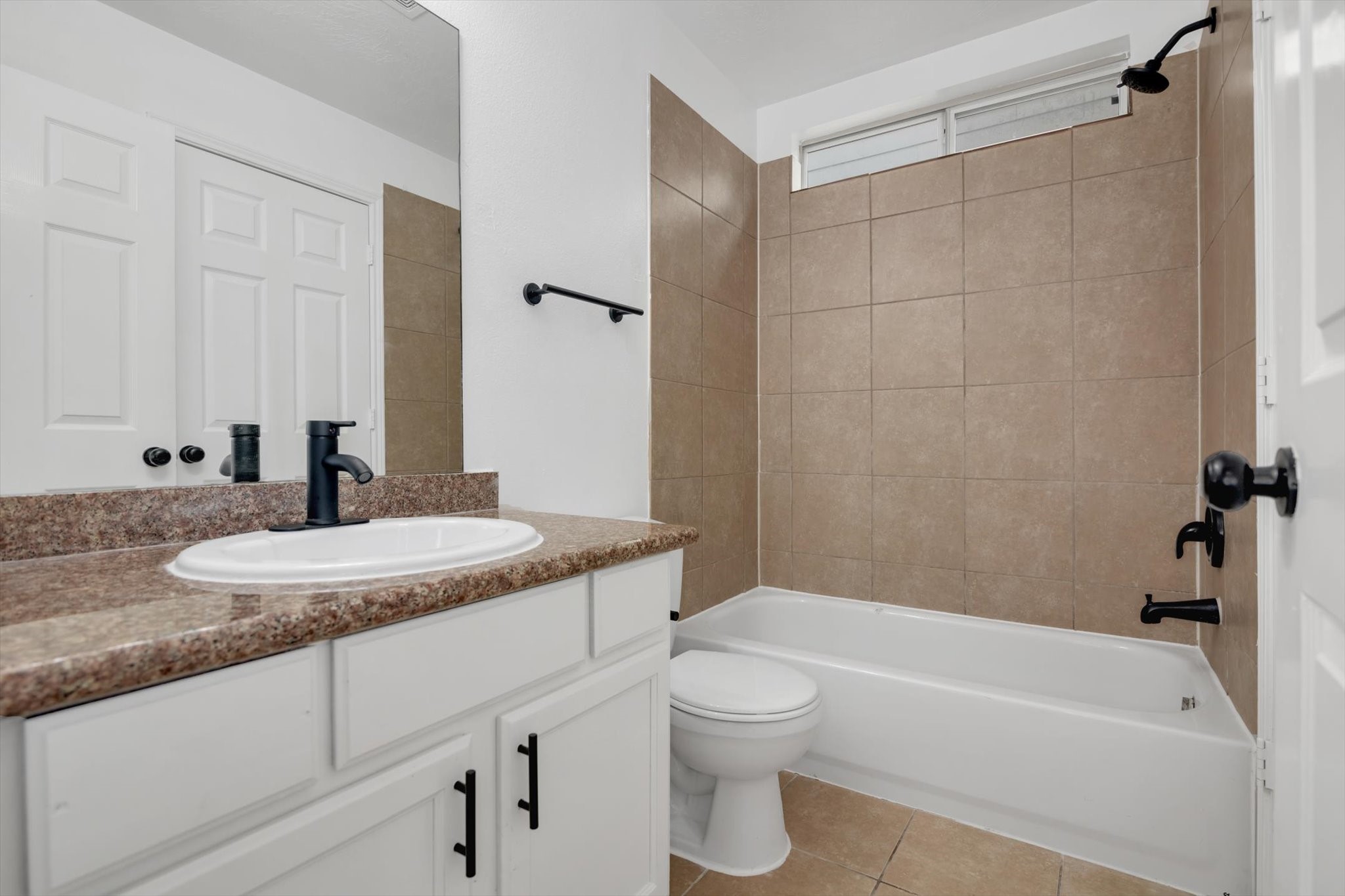 6933 Liverpool Street, Unit A Houston, TX 77021 - Photo 12 of 49 a bathroom with a granite countertop sink toilet and shower