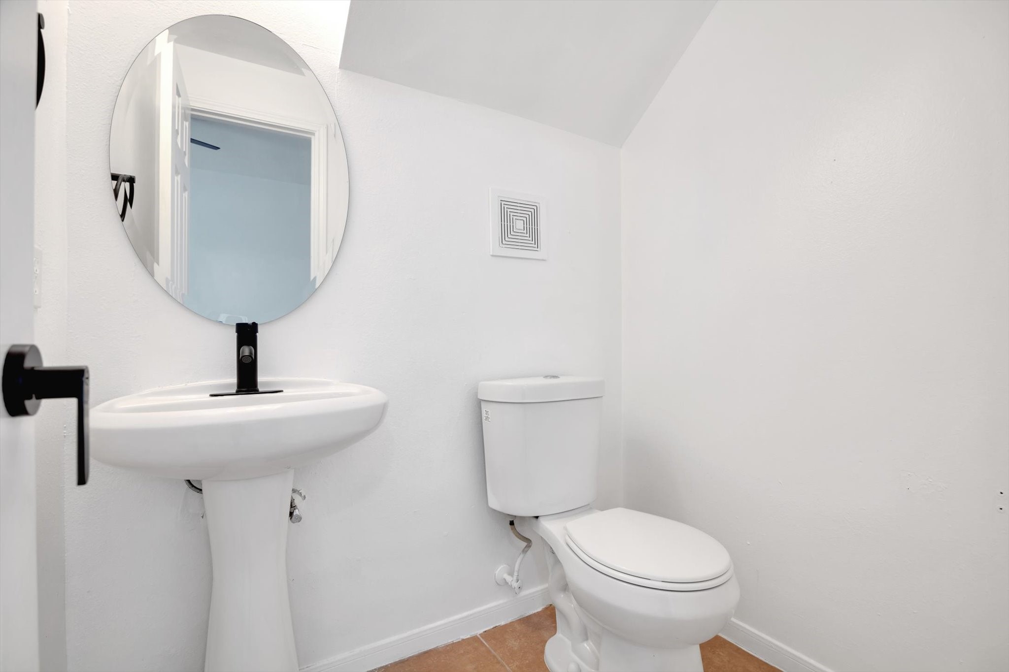6933 Liverpool Street, Unit A Houston, TX 77021 - Photo 14 of 49 a bathroom with a toilet sink and mirror
