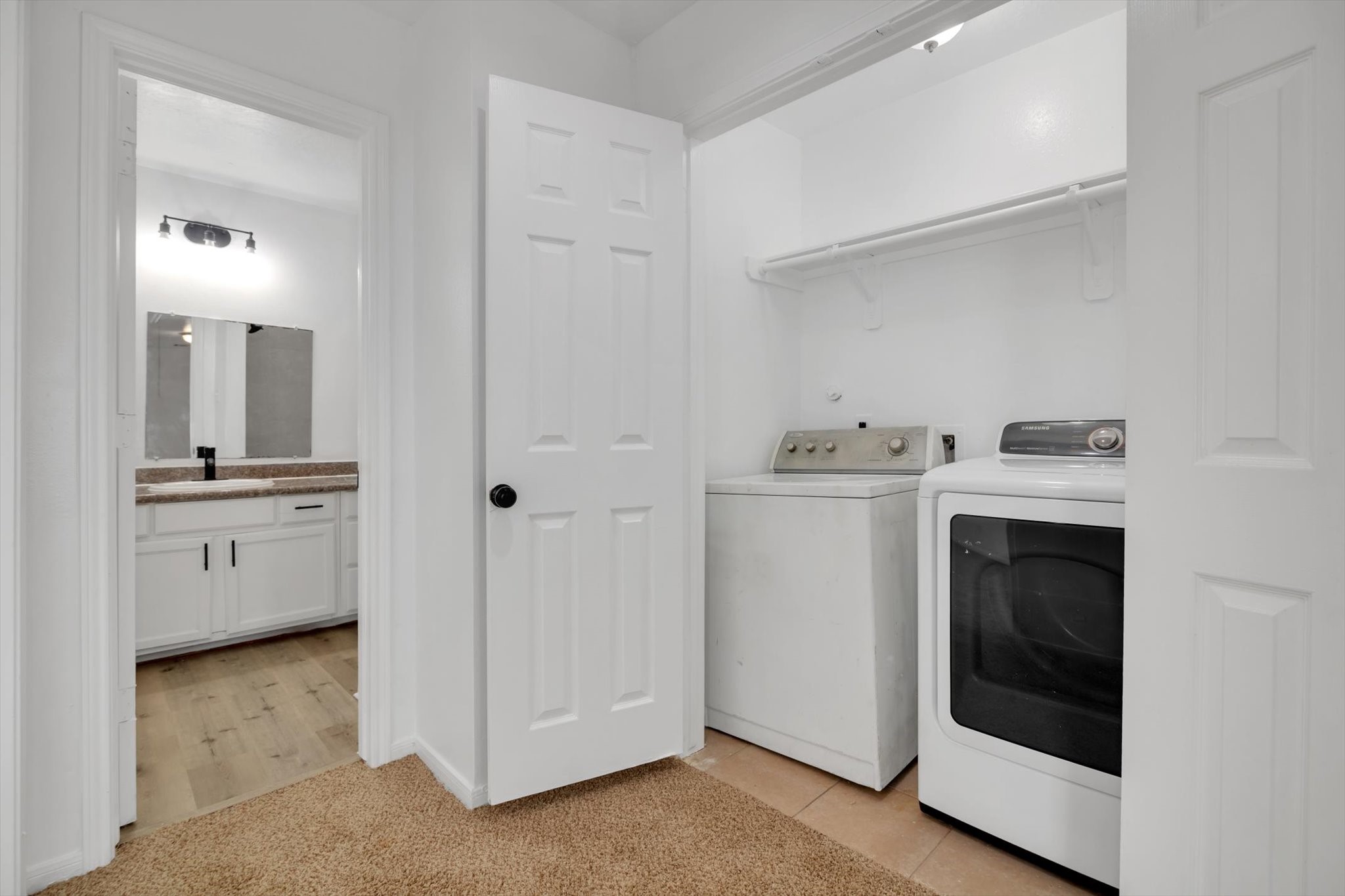 6933 Liverpool Street, Unit A Houston, TX 77021 - Photo 15 of 49 a utility room with cabinets washer and dryer