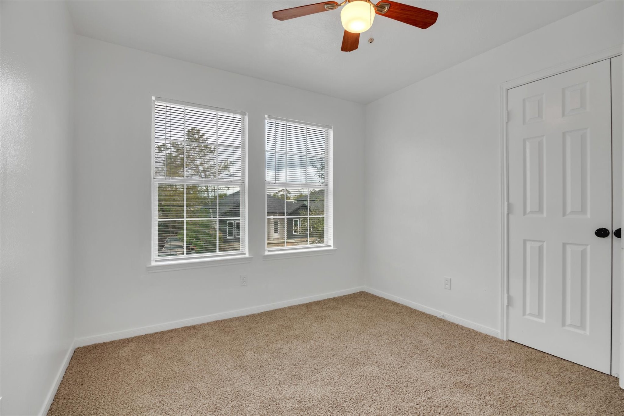 6933 Liverpool Street, Unit A Houston, TX 77021 - Photo 19 of 49 an empty room with chandelier fan and window