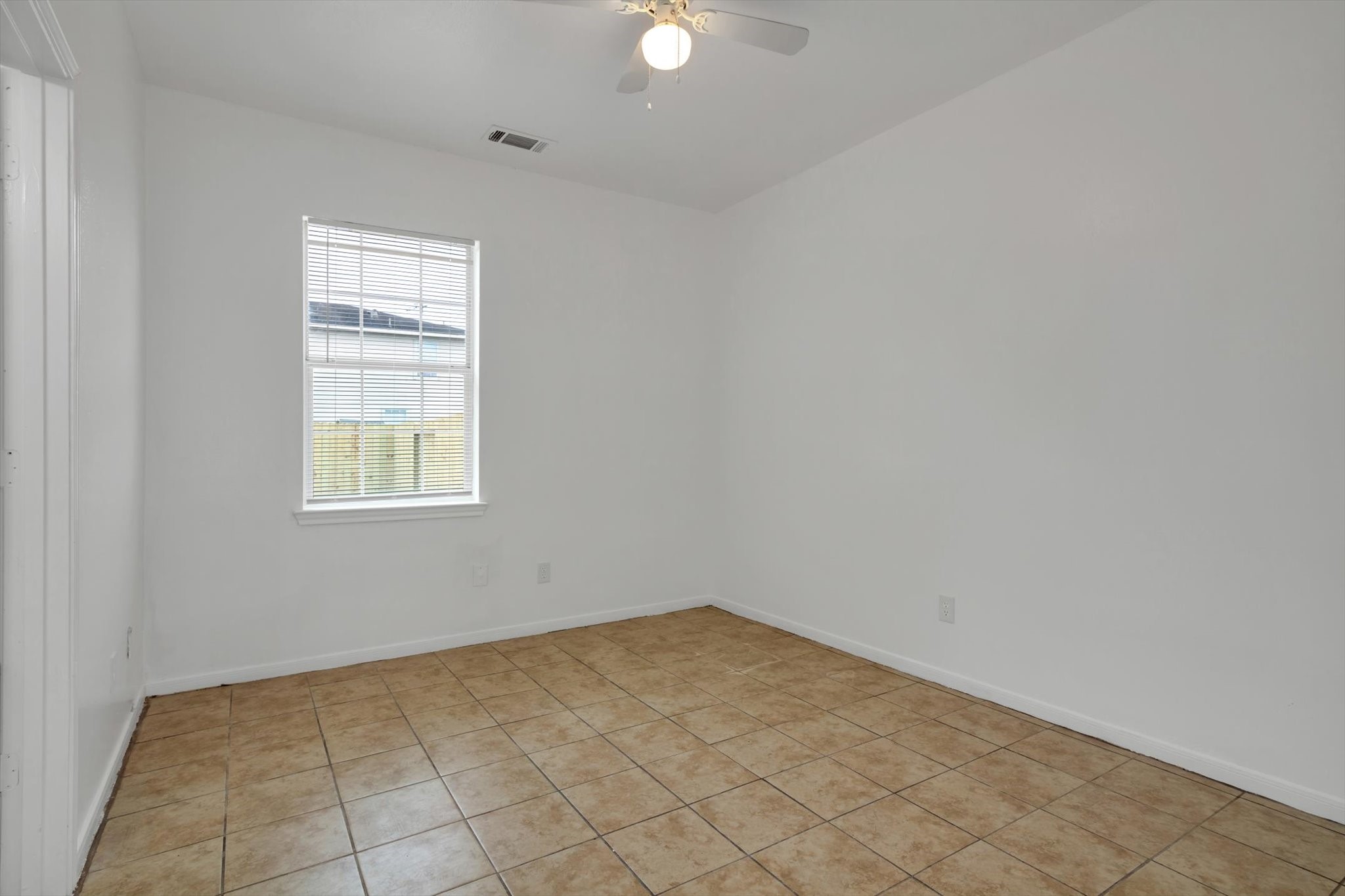 6933 Liverpool Street, Unit A Houston, TX 77021 - Photo 23 of 49 an empty room with windows