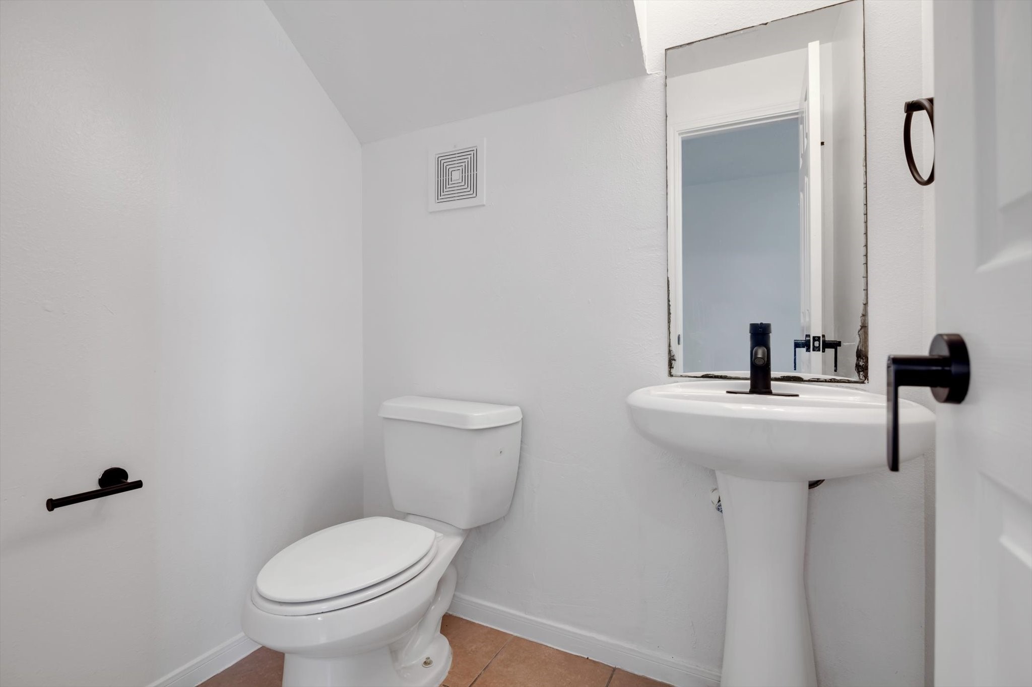 6933 Liverpool Street, Unit A Houston, TX 77021 - Photo 30 of 49 a bathroom with a sink toilet and mirror