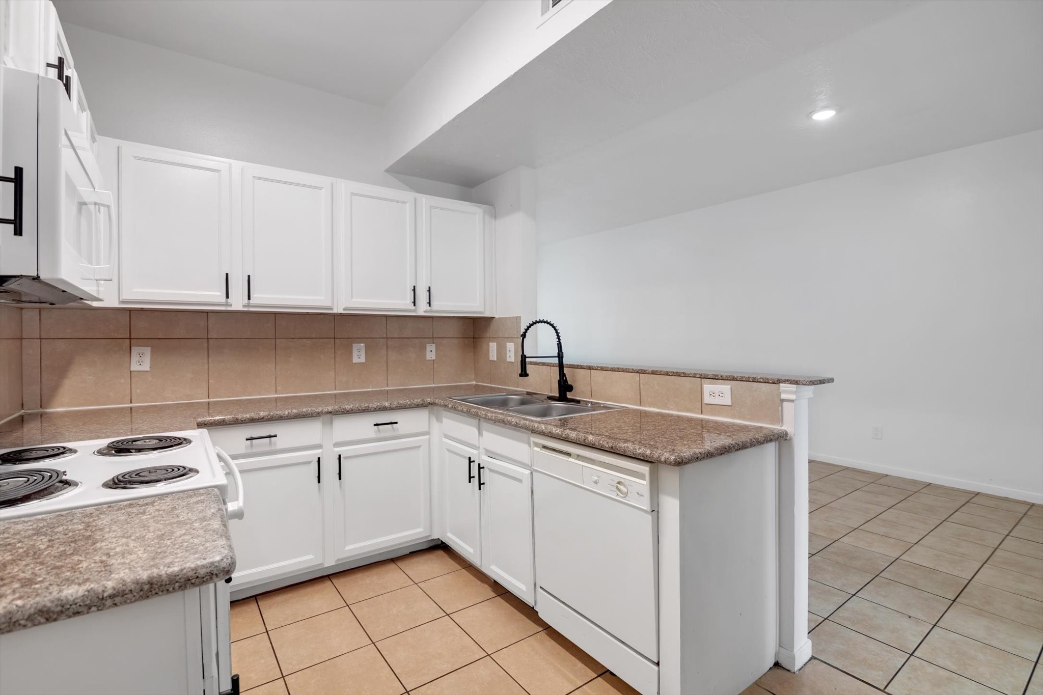 6933 Liverpool Street, Unit A Houston, TX 77021 - Photo 38 of 49 a kitchen with stainless steel appliances granite countertop a sink stove and cabinets