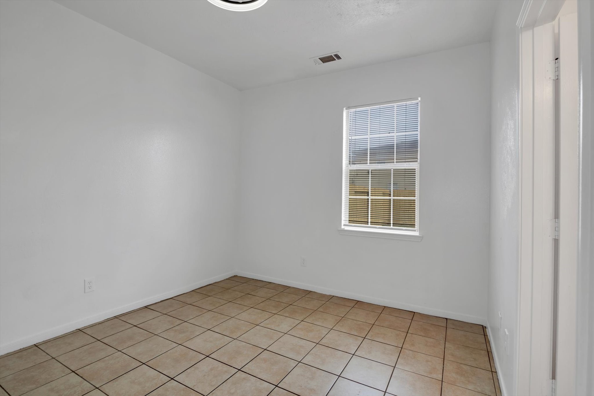 6933 Liverpool Street, Unit A Houston, TX 77021 - Photo 40 of 49 an empty room with windows