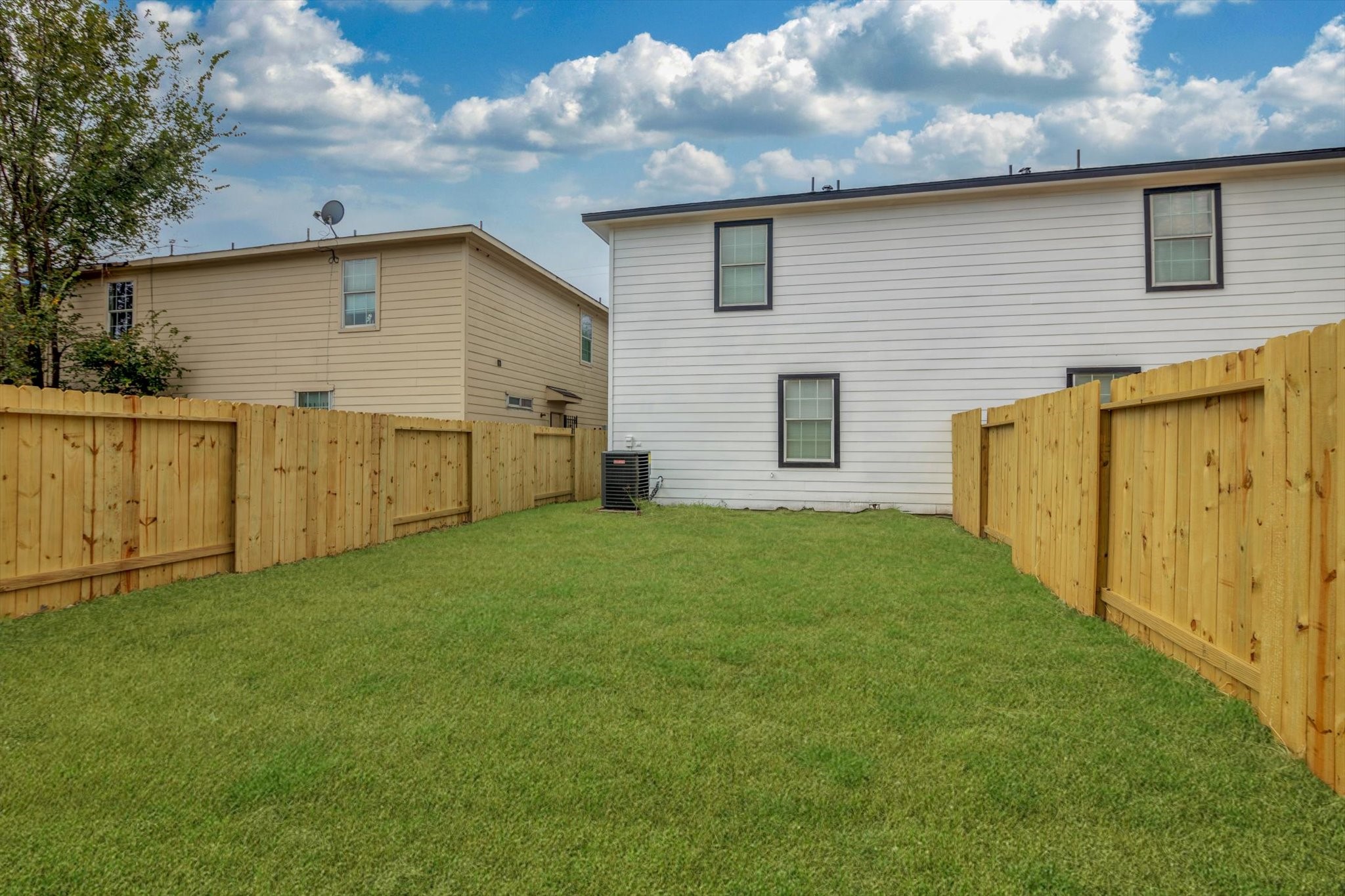 6933 Liverpool Street, Unit A Houston, TX 77021 - Photo 47 of 49 a view of a backyard with wooden fence