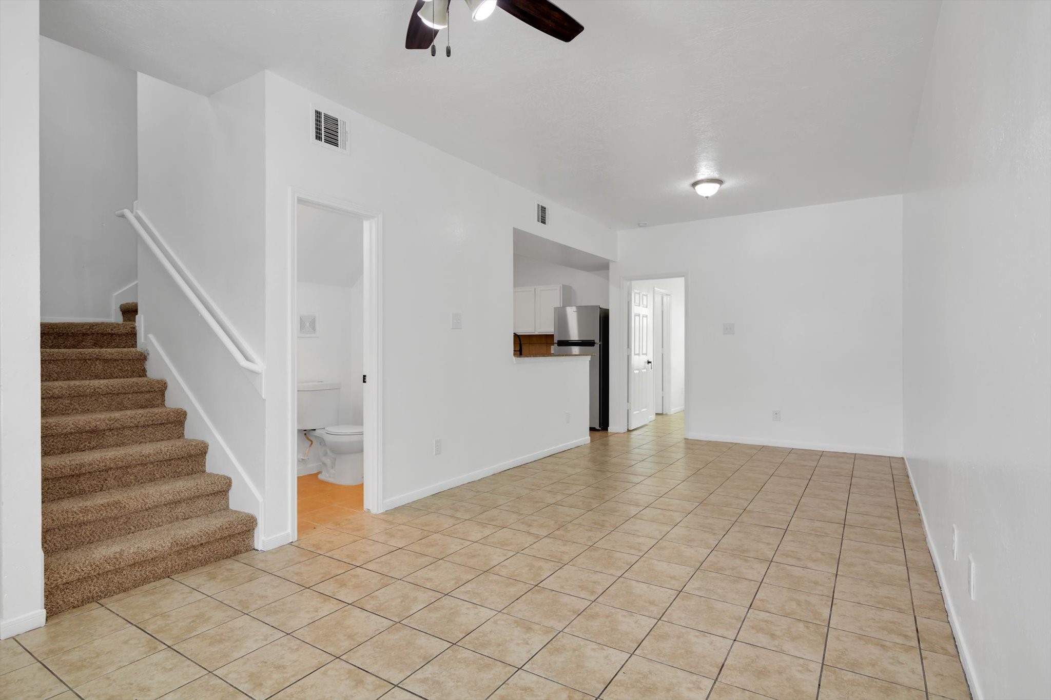 6933 Liverpool Street, Unit A Houston, TX 77021 - Photo 6 of 49 a view of an empty room and stairs