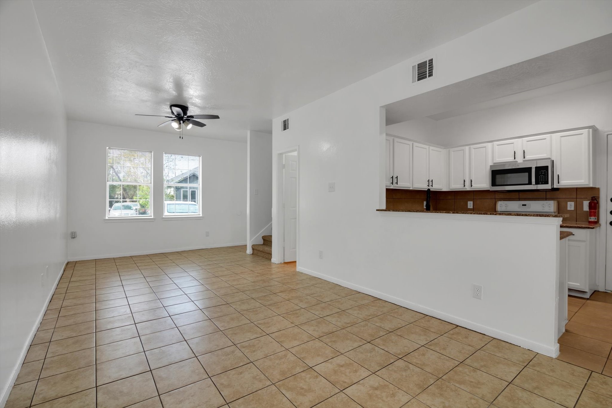 6933 Liverpool Street, Unit A Houston, TX 77021 - Photo 8 of 49 a view of a kitchen with a sink and dishwasher cabinets