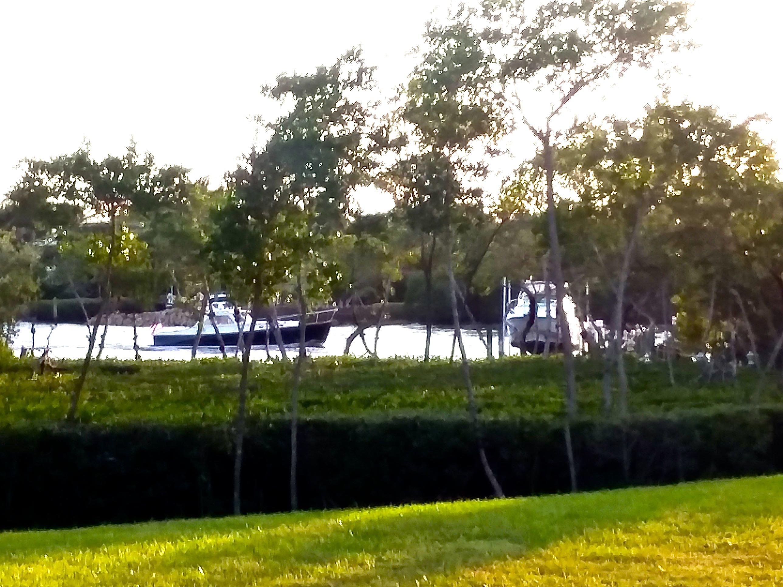 332 River Edge Road Jupiter, FL 33477 - Photo 45 of 103 Boat Passing (1)