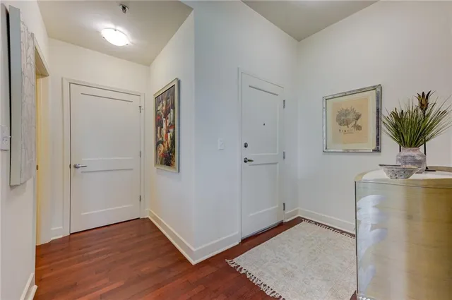 a bathroom with a granite countertop sink a toilet and a shower