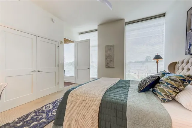 a bedroom with a bed and a table in it