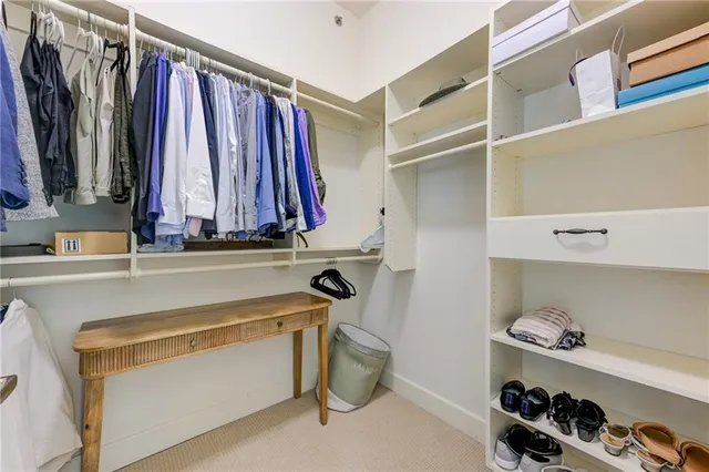 a living room with furniture a wooden floor and next to a window