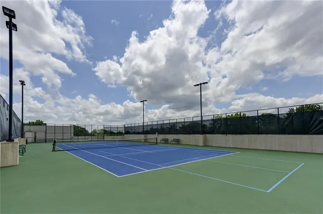 a view of a swimming pool with outdoor seating and a buildings