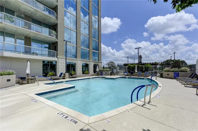 a view of a porch with furniture and a yard