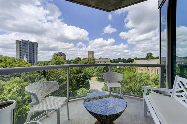 a view of a balcony with chair and table