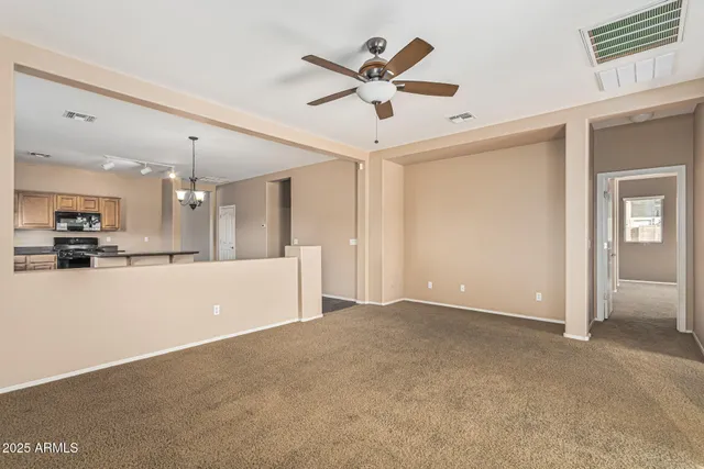 a kitchen with stainless steel appliances granite countertop a sink stove and microwave