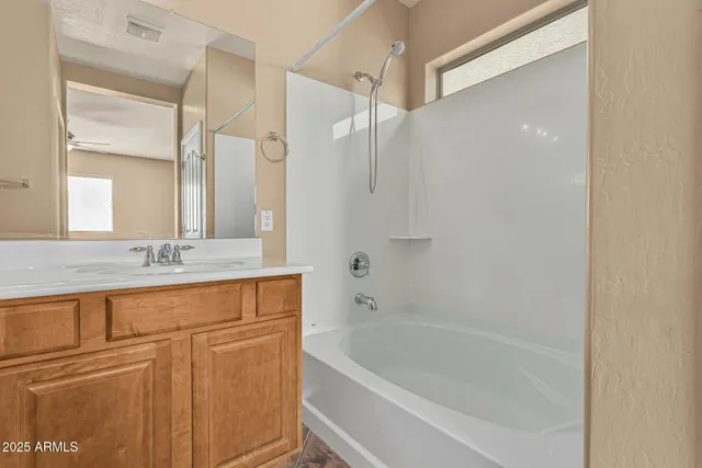 a view of a white house with a outdoor space