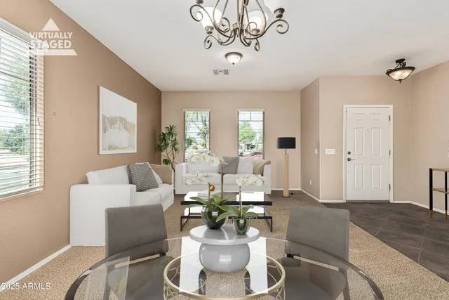 a living room with furniture and a large window