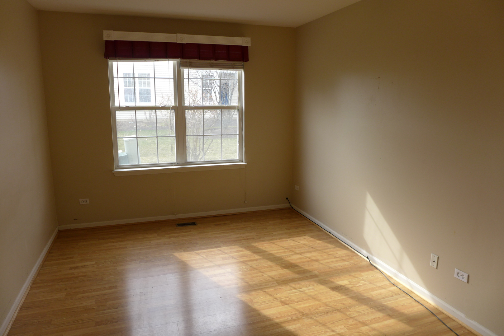 3076 Falling Waters Lane Lindenhurst, IL 60046 - Photo 11 of 15 an empty room with a window