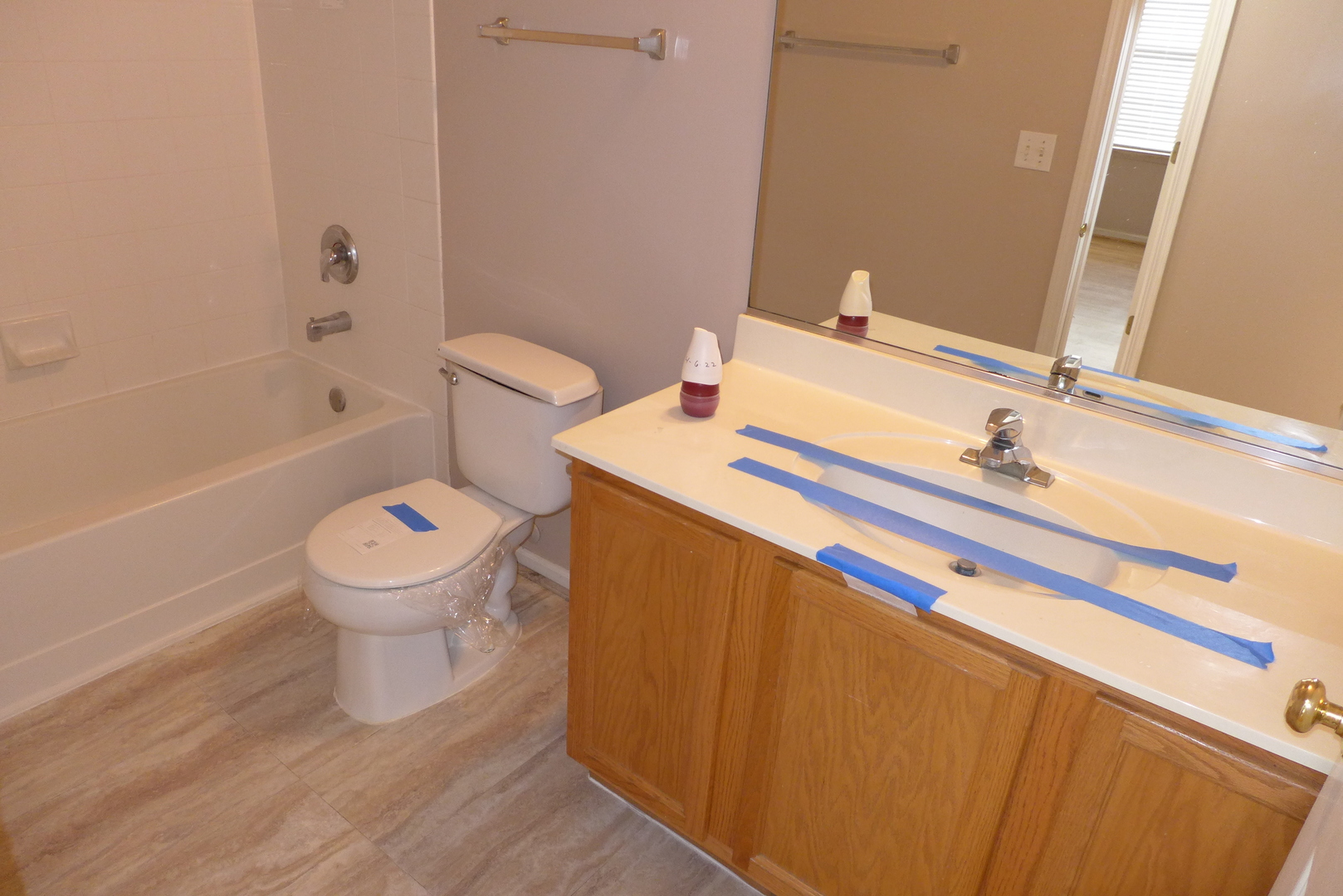 3076 Falling Waters Lane Lindenhurst, IL 60046 - Photo 14 of 15 a bathroom with a sink toilet and shower
