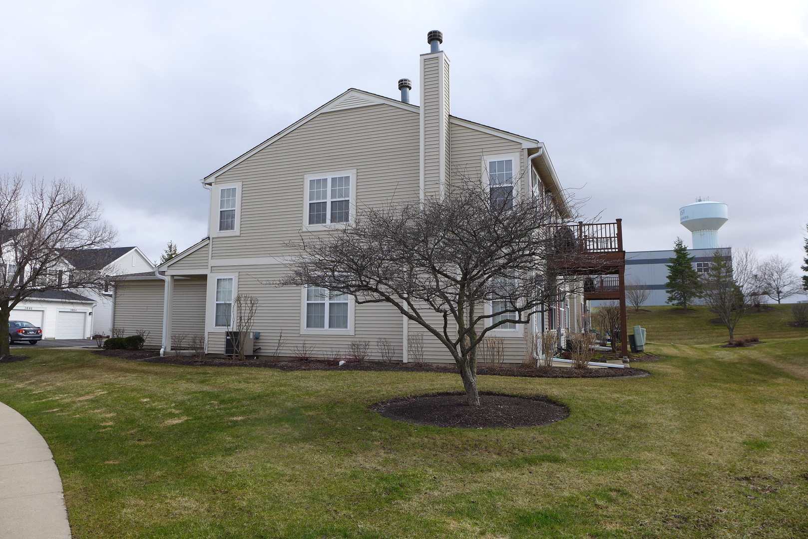 3076 Falling Waters Lane Lindenhurst, IL 60046 - Photo 3 of 15 a front view of a house with a yard