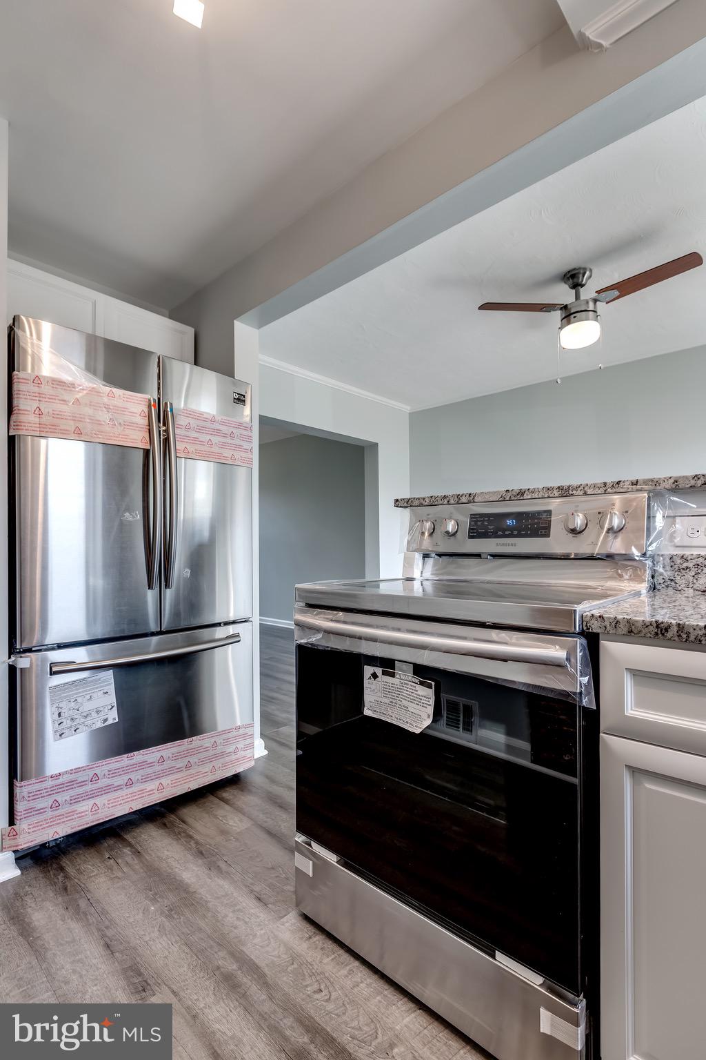 228 West Edgevale Road Baltimore, MD 21225 - Photo 14 of 39 Double Open Refrigerator and Electric Range.