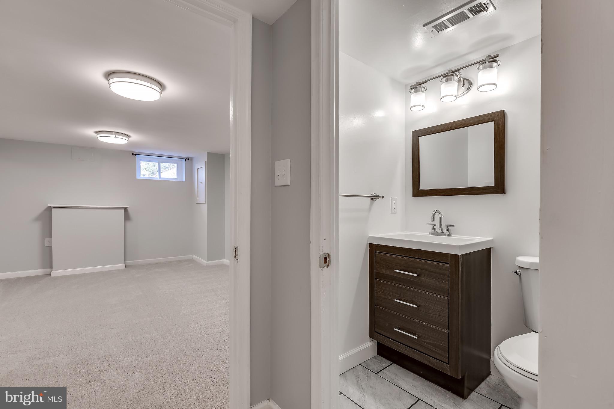 228 West Edgevale Road Baltimore, MD 21225 - Photo 27 of 39 Lower Level Recreation Room with Full Bath