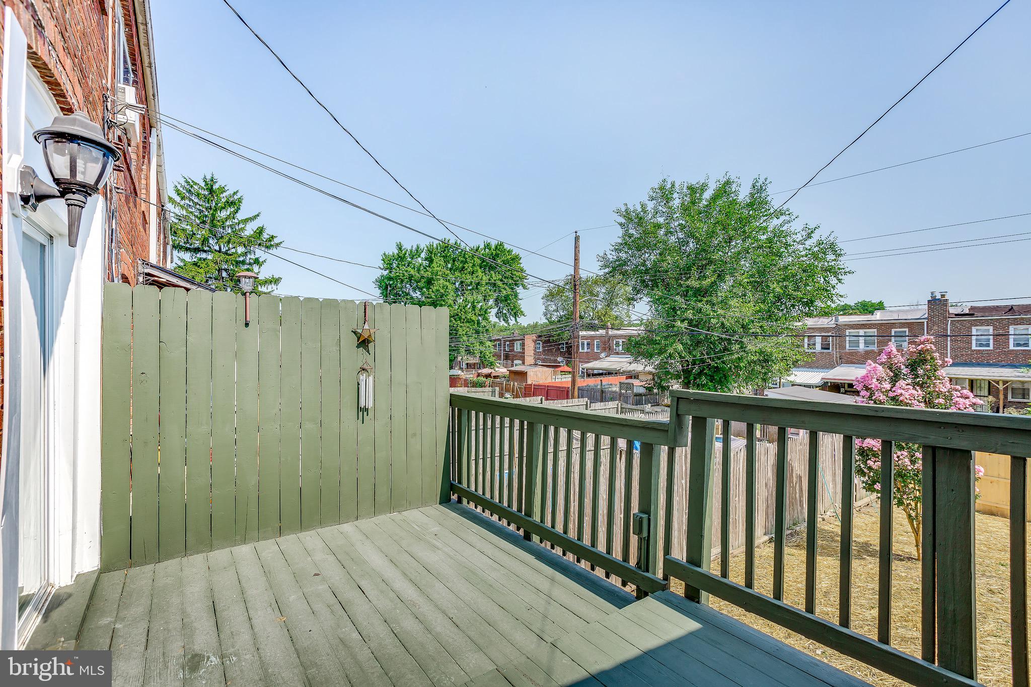 228 West Edgevale Road Baltimore, MD 21225 - Photo 36 of 39 Open deck off dining room/kitchen.