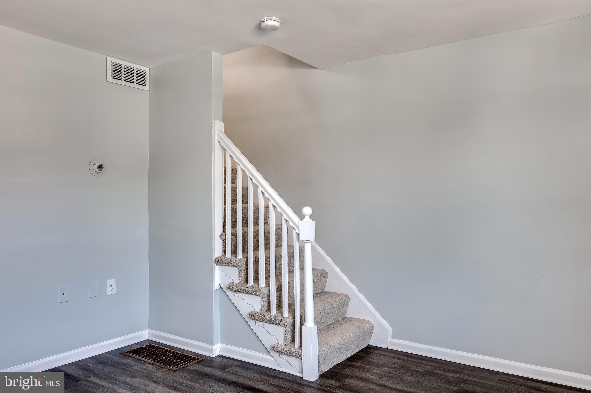 228 West Edgevale Road Baltimore, MD 21225 - Photo 7 of 39 Stairwell into upper level.