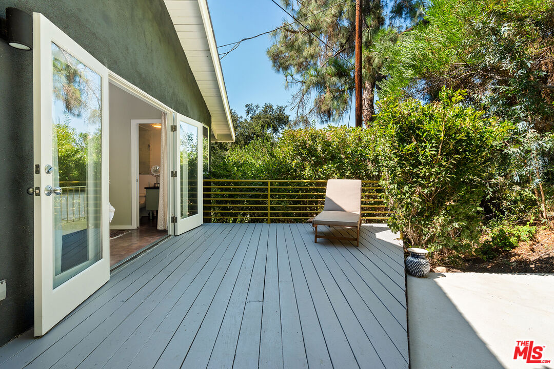3775 Fredonia Drive Los Angeles, CA 90068 - Photo 11 of 16 a house with wooden floor and potted plants
