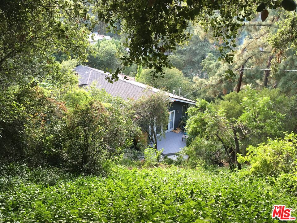 3775 Fredonia Drive Los Angeles, CA 90068 - Photo 16 of 16 a wooden fence with some trees in the background