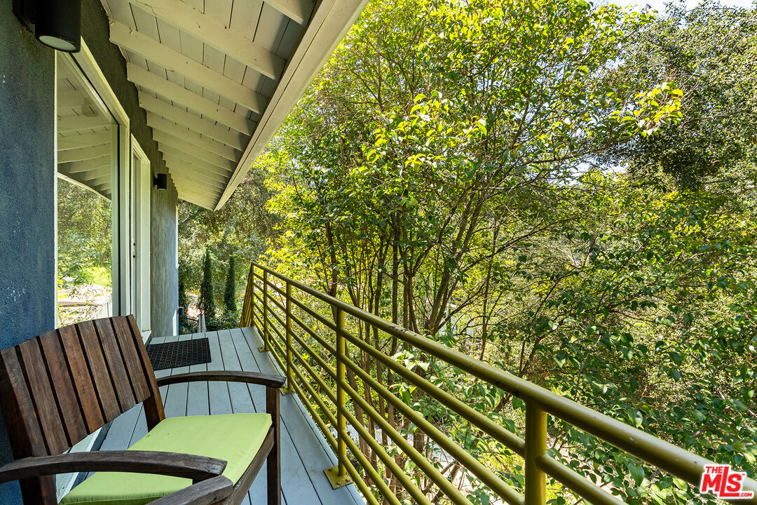 3775 Fredonia Drive Los Angeles, CA 90068 - Photo 4 of 16 a view of a chair in a balcony