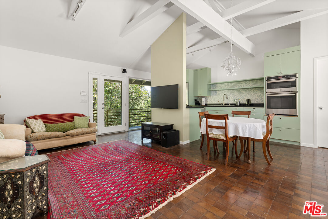 3775 Fredonia Drive Los Angeles, CA 90068 - Photo 6 of 16 a living room with furniture and a fireplace