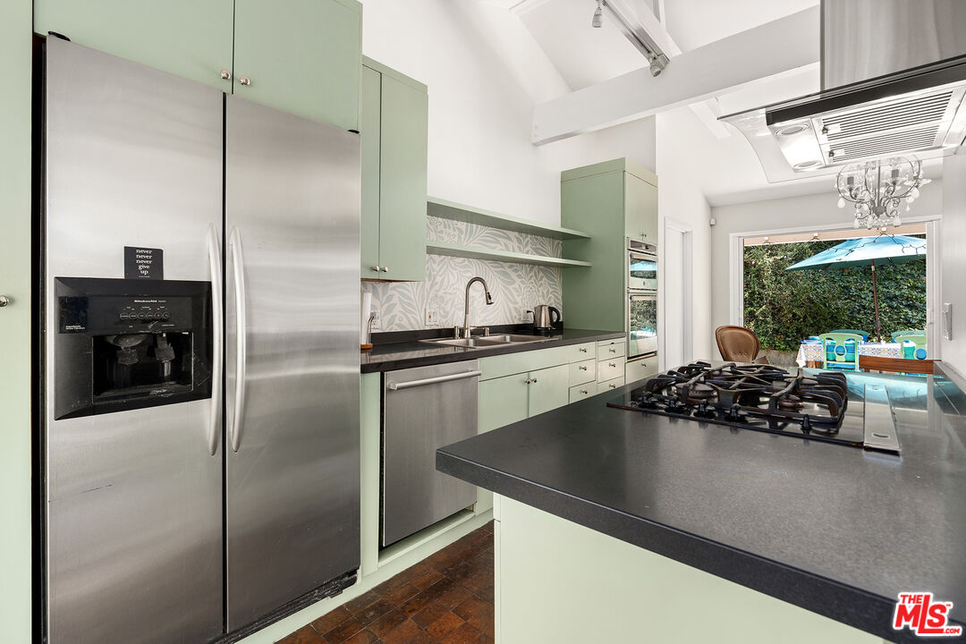 3775 Fredonia Drive Los Angeles, CA 90068 - Photo 8 of 16 a kitchen with a refrigerator and a sink