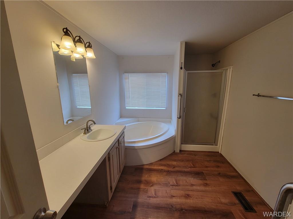3469 Bouse Road Golden Valley, AZ 86413 - Photo 23 of 37 a bathroom with a tub sink toilet and mirror