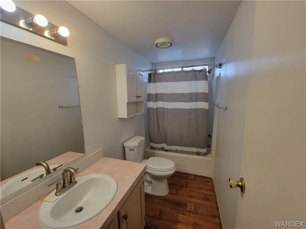 3469 Bouse Road Golden Valley, AZ 86413 - Photo 29 of 37 a bathroom with a sink toilet and shower