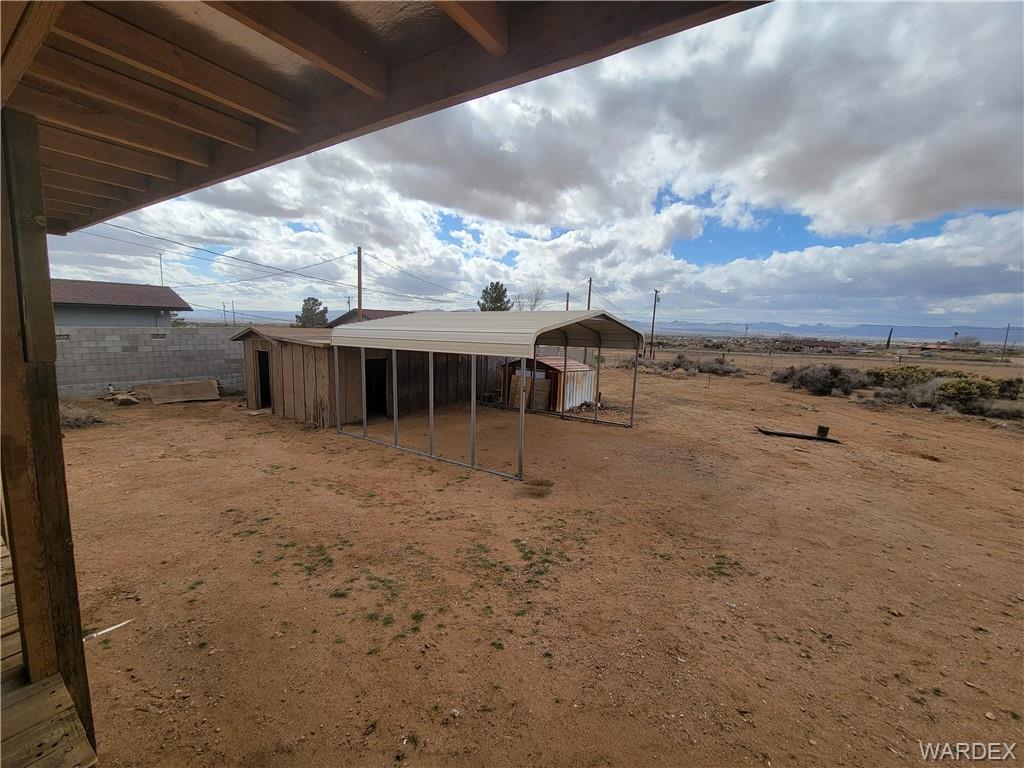 3469 Bouse Road Golden Valley, AZ 86413 - Photo 36 of 37 a view of a house with a yard
