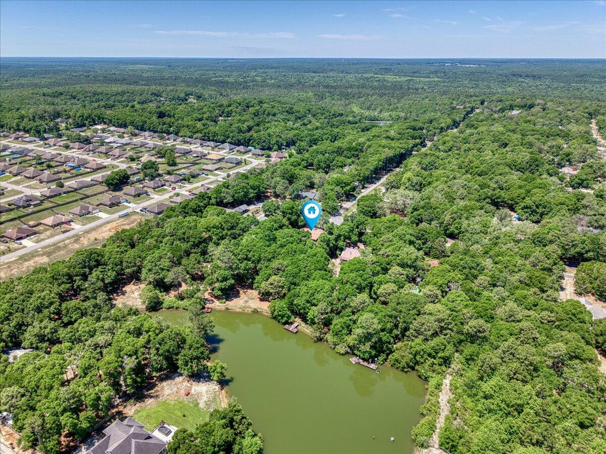 210 Shell Drive Crestview, FL 32536 - Photo 66 of 67 a view of a lake with a city